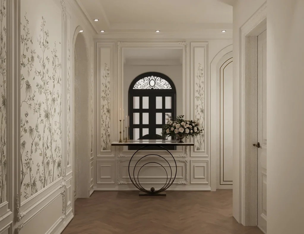 تصميم مدخل وممر فيلا سكني في جدة بورق جدران مشجر ونقوش ناعمة، مع كونسول معدني رقيق، يبرز التوازن الدقيق والكلاسيكية المعاصرة لـ TELA Architects.