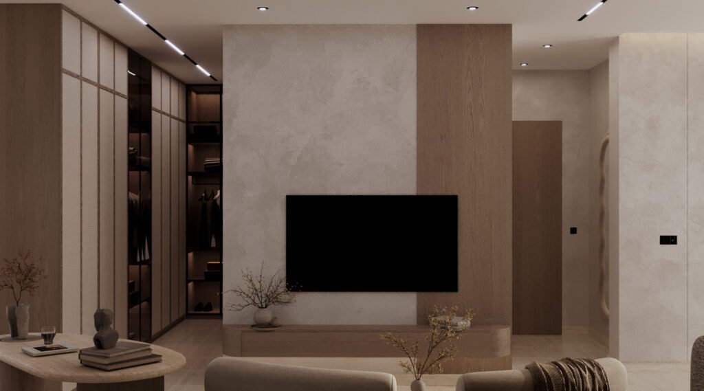 جدار تلفزيون وغرفة ملابس مدمجة (Dressing Room) بإضاءة داخلية دافئة لخزائن الملابس، تنفيذ شركة تيلا الهندسية.